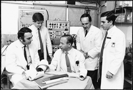 Paul Korner with staff in lab, Copyright held by image owner